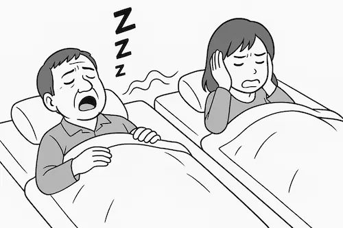 いびきをする中年男性と耳を塞ぐ奥さん